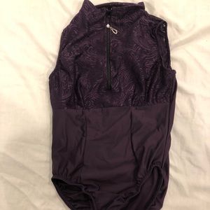 Purple lace leotard with zipper in the front.